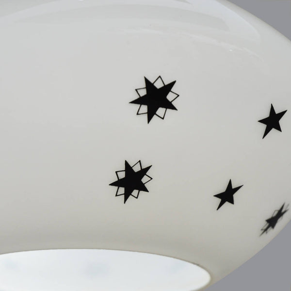 1950s white glass ceiling light with black top and star pattern